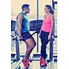 attractive couple at the gym looking happy