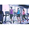 group of young people running on treadmills in modern sport  gym