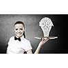 Pretty woman holding tray with successful idea concept