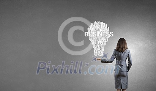 Rear view of businesswoman holding in hands successful idea concept Rear view of businesswoman holding in hands successful idea concept