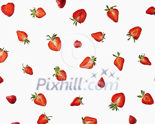 Halves of a fresh strawberry with green leaves on a gray background. Creative pattern of berries, flat lay