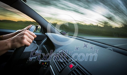Man driving a car moving fast on a highway (motion blurred image) Man driving a car moving fast on a highway (motion blurred image)