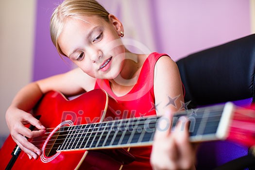 Teenage girl with her guitar in her lovely room Teenage girl with her guitar in her lovely room