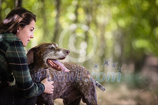 Autumn hunting season. Hunting. Outdoor sports. Woman hunter in the woods Autumn hunting season. Hunting. Outdoor sports. Woman hunter in the woods