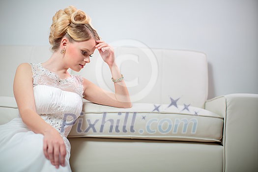 Gorgeous bride on her wedding day - not  so thrilled about her big day(color toned image; shallow DOF)