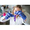 Female researcher carrying out scientific research in a lab (shallow DOF; color toned image)