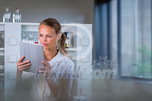 Portrait of a female researcher doing research in a lab, using a tablet computer for data collection and visualization(shallow DOF; color toned image) Portrait of a female researcher doing research in a lab, using a tablet computer for data collection and visualization(shallow DOF; color toned image)