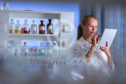 Portrait of a female researcher doing research in a lab (shallow DOF; color toned image) Portrait of a female researcher doing research in a lab (shallow DOF; color toned image)