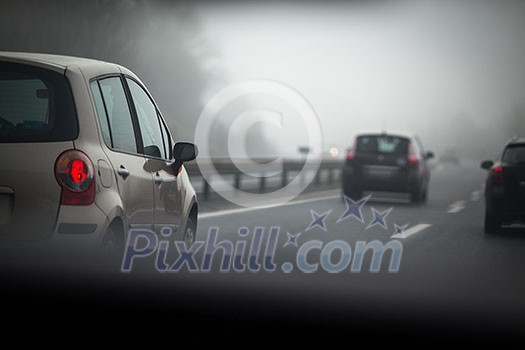 Cars going fast on a highway