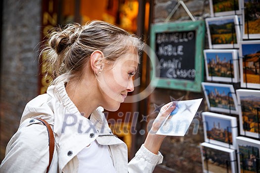 Young woman messaging/using app on her smart-phone in a city street context (shallow DOF; color toned image) Young woman messaging/using app on her smart-phone in a city street context (shallow DOF; color toned image)