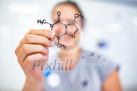 Young woman holding up a molecular model of nicotin Young woman holding up a molecular model of nicotin