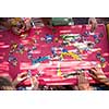 top view of kids hands playing with puzzles in outdoor playground