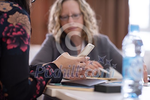 Group of a young business people brainstorming and discussing business plan on meeting at startup office interior Group of a young business people brainstorming and discussing business plan on meeting at startup office interior