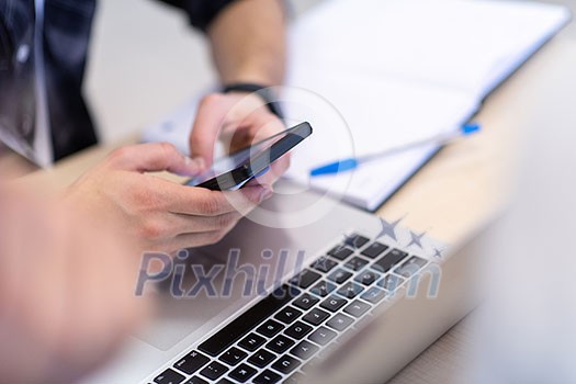 business people hands typing on smart phone during the seminar at conference room business people hands typing on smart phone during the seminar at conference room