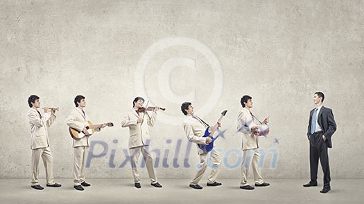 Man orchestra in suit playing different music instruments Man orchestra in suit playing different music instruments
