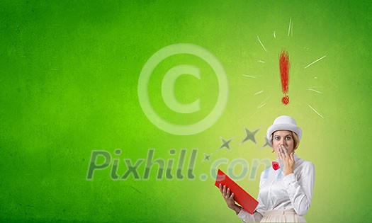 Young woman in white hat with opened red book in hands Young woman in white hat with opened red book in hands