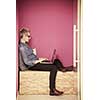 young woman in crative box working on laptop computer, startup business modern office room  interior