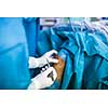 Knee surgery, Orthopedic Operation  - two surgeons performing a knee surgery on a patient (shallow DOF; color toned image)