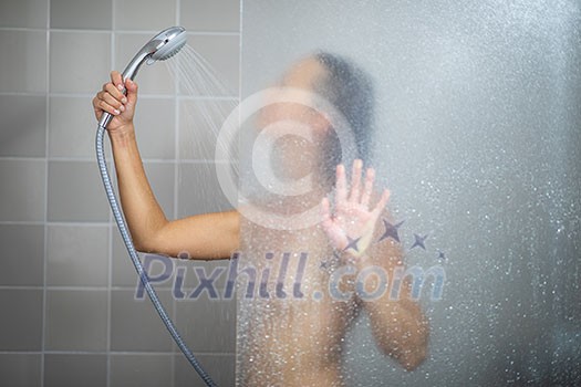 Pretty, young woman in shower