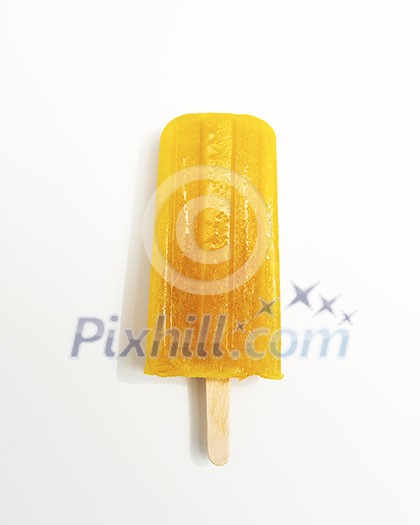 Homemade orange ice lolly sorbet on white background with space for text. The concept of healthy dietary dessert. Top view