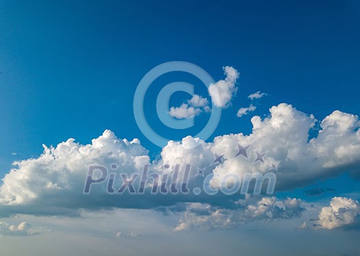 Beautiful clouds with blue sky background. Nature weather, cloud blue sky at summer sunset. Aerial view from drone.