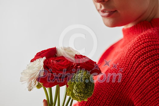 The girl without face with bouquet of flowers on a wtite background with place under text.