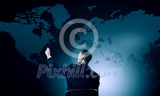 Back view of businessman working with virtual panel Back view of businessman working with virtual panel