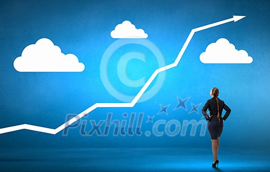 Back view of confident businesswoman with arms on waist Back view of confident businesswoman with arms on waist