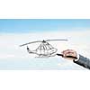 Hand drawing with stylus helicopter model on sky background