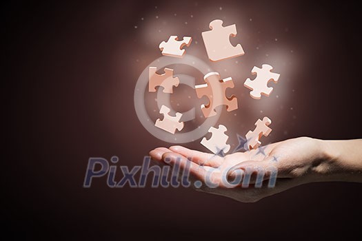 Human hand holding in palm puzzle elements Human hand holding in palm puzzle elements