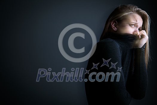 Young woman suffering from a severe depression/anxiety Young woman suffering from a severe depression/anxiety