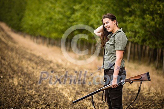 Autumn hunting season. Hunting. Outdoor sports. Woman hunter in the woods Autumn hunting season. Hunting. Outdoor sports. Woman hunter in the woods