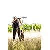 Autumn hunting season. Hunting. Outdoor sports. Woman hunter in the woods with her well trained dog