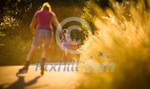 Young woman running outdoors on a lovely sunny summer evening (shallow DOF; color toned image)