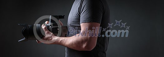 Photographer with a medium format camera in his studio Photographer with a medium format camera in his studio