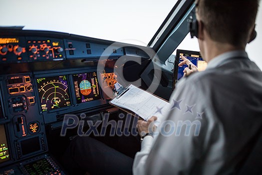 Pilot's hand accelerating on the throttle in  a commercial airliner airplane flight cockpit during takeoff