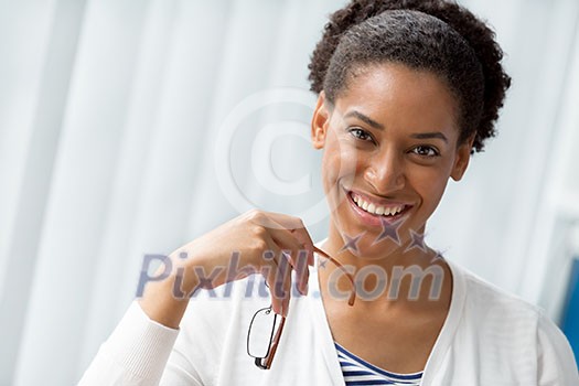 Businesswoman smiling and sitting in offfice Businesswoman smiling and sitting in offfice