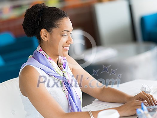 Young business woman working with laptop in office Young business woman working with laptop in office