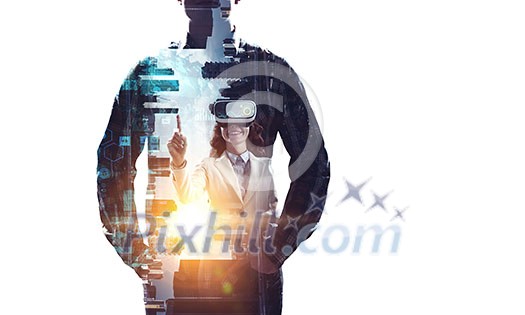 Businesswoman trying virtual reality glasses. Mixed media Businesswoman trying virtual reality glasses. Mixed media