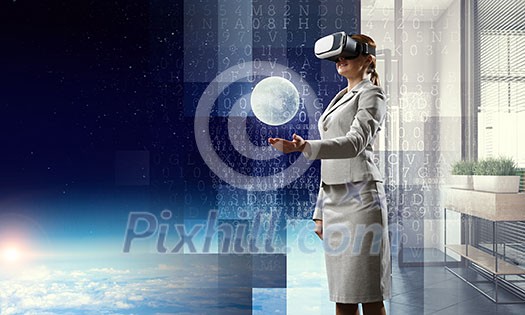 Businesswoman trying virtual reality glasses. Mixed media Businesswoman trying virtual reality glasses. Mixed media