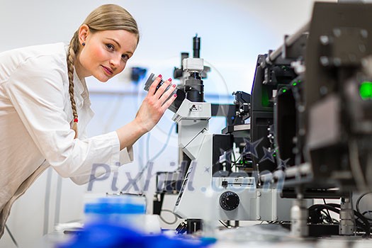Female researcher carrying out research in a chemistry lab (color toned image; shallow DOF) Female researcher carrying out research in a chemistry lab (color toned image; shallow DOF)