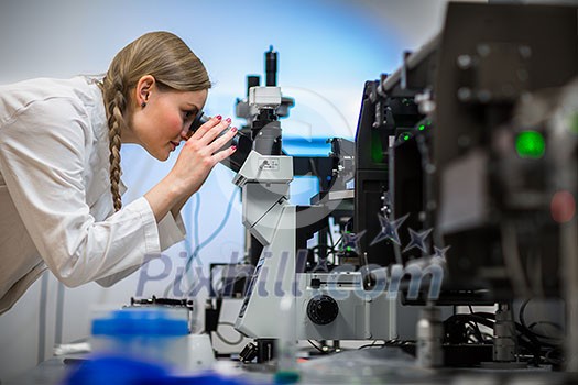 Female researcher carrying out research in a chemistry lab (color toned image; shallow DOF) Female researcher carrying out research in a chemistry lab (color toned image; shallow DOF)