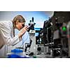 Female researcher carrying out research in a chemistry lab (color toned image; shallow DOF)