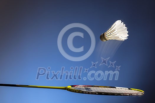 Badminton racket and shuttlecock in motion closeup Badminton racket and shuttlecock in motion closeup