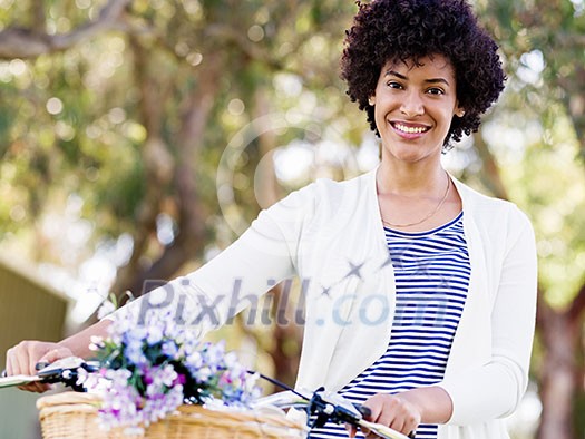 Happy young woman with bicycle in the park Happy young woman with bicycle in the park