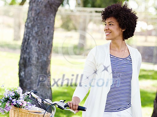 Happy young woman with bicycle in the park Happy young woman with bicycle in the park