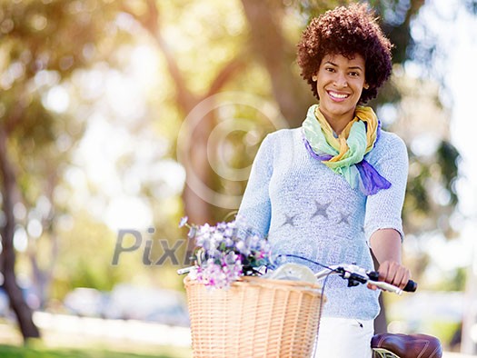 Happy young woman with bicycle in the park Happy young woman with bicycle in the park