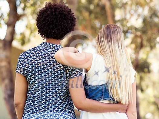 Two women friends in summer park