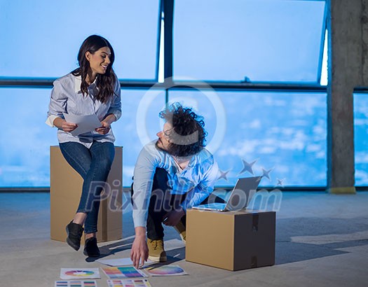 young team of business people in group, architect and engineer on construction site checking documents and business workflow using laptop computer in new startup office