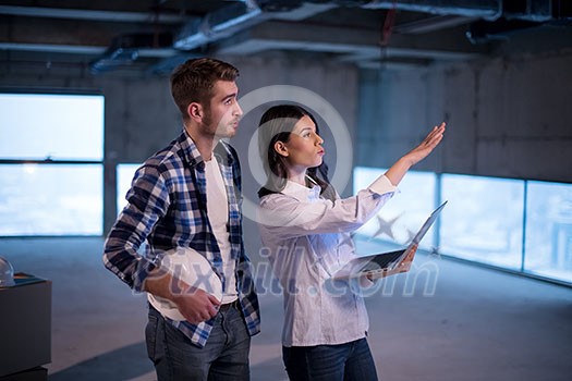 young team of business people in group, architect and engineer on construction site checking documents and business workflow using laptop computer in new startup office young team of business people in group, architect and engineer on construction site checking documents and business workflow using laptop computer in new startup office